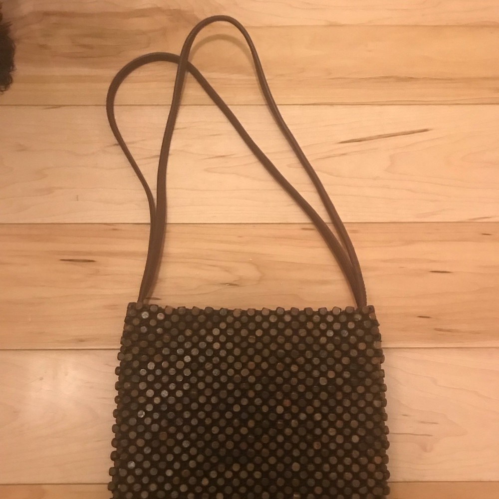 The Sak brown wooden and mesh purse